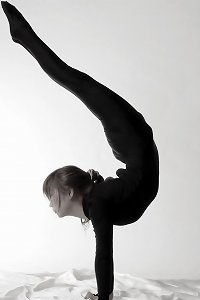 a female wearing a thong has her butt up