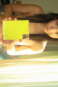 asian girl taking her huge shaved tits off and playing with an asia dildo